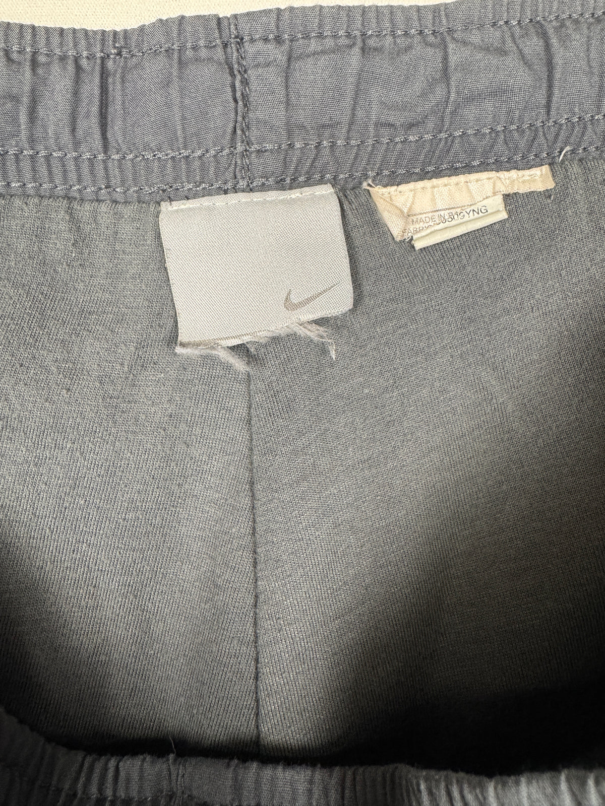 Nike Early 2000s Vintage Grey Track Bottoms with White and Red Accent Piping